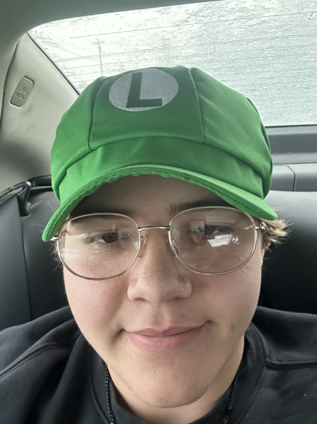 Maven Ragusa Wearing a Luigi Hat
